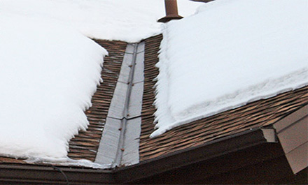 The low-voltage RoofHeat STEP roof de-icing system installed in roof valley and eave.