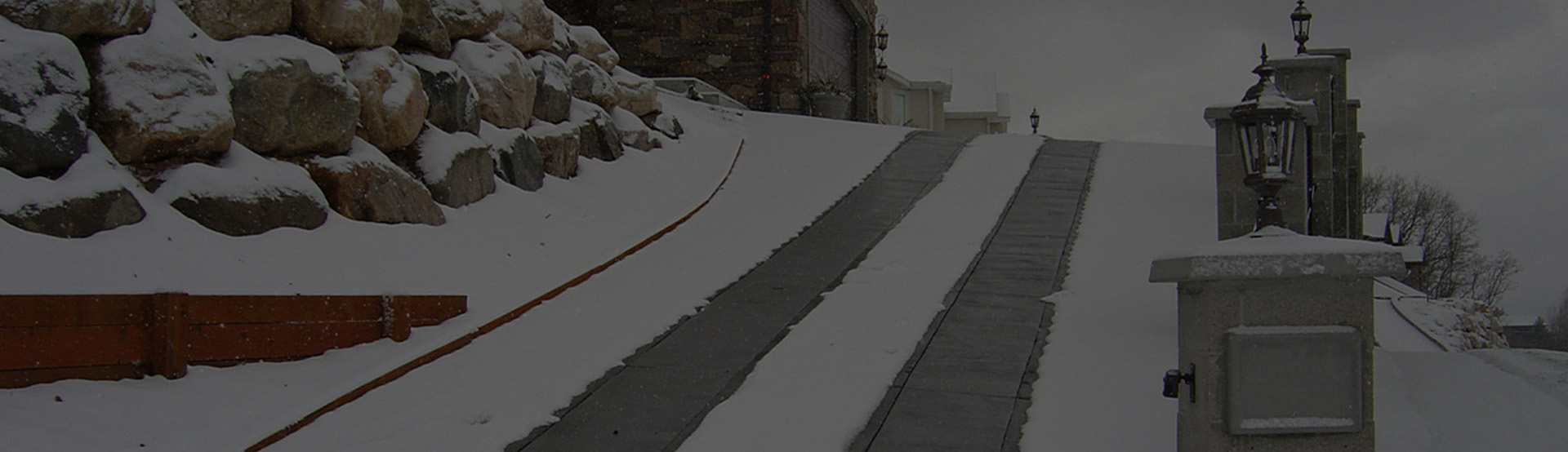 A heated driveway and walkways in operation during a snowstorm